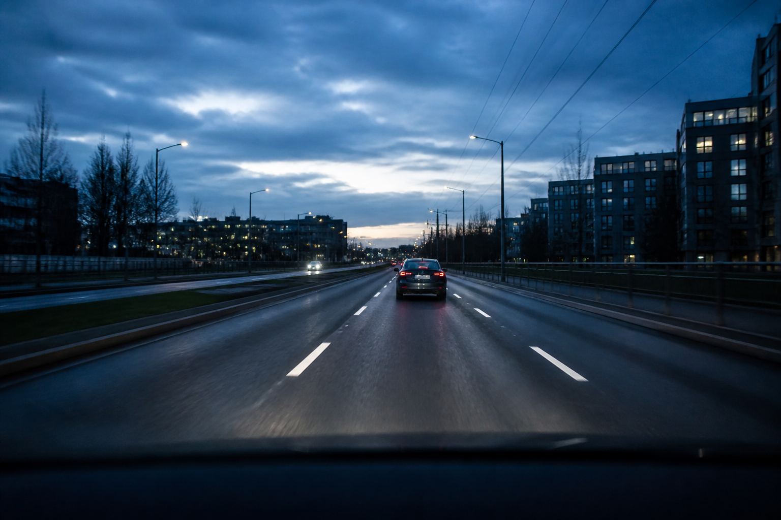 A car driving on a European road at blue hour